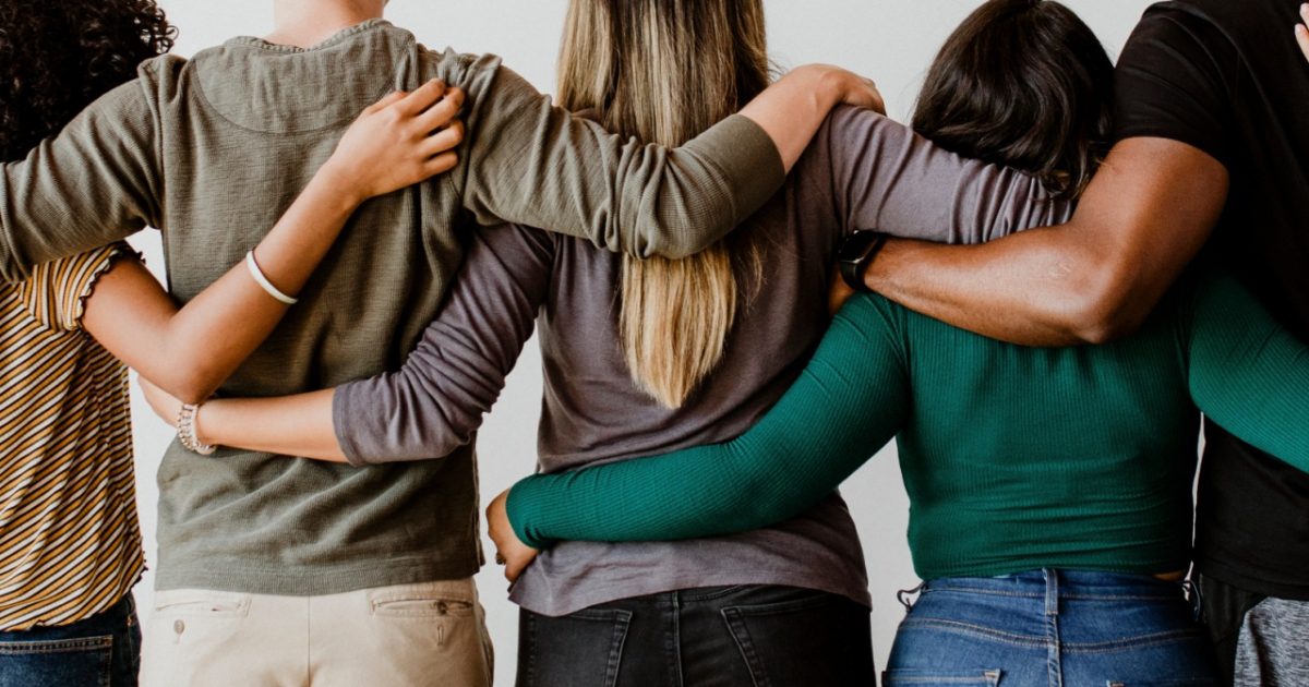 Group of people standing in a line.