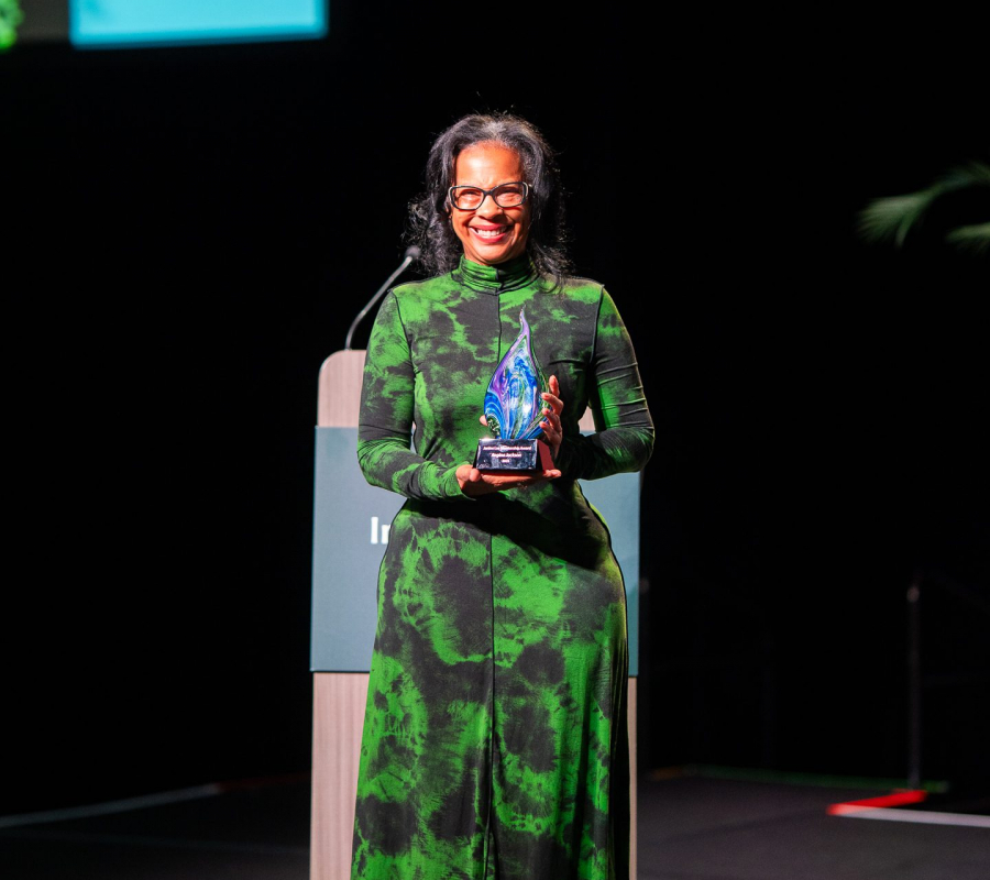 Regina Jackson accepting Janine Lee Mentorship Award